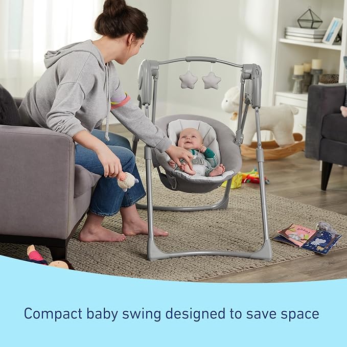 Slim Spaces Compact Baby Swing, Space Saving Portable Bay Swing with Height Adjustable Legs & Soft Toys, Reign
